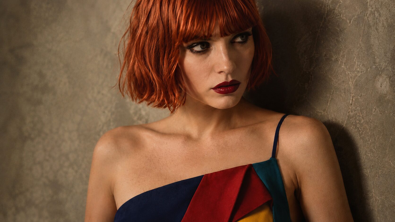 AI fashion portrait, auburn bob model looking off-frame, collarbone and dress bodice detail, warm grade
